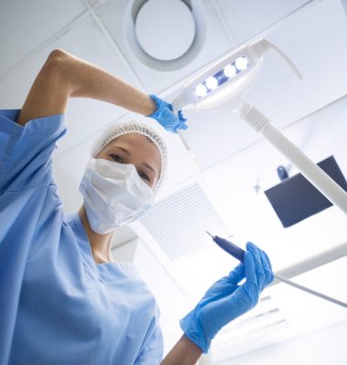 dental-assistant-in-surgical-mask-holding-dental-tools.jpg dental-assistant-in-surgical-mask-holding-dental-tools.jpg